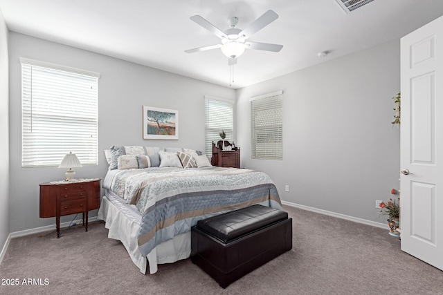 bedroom with visible vents, baseboards, carpet, and a ceiling fan