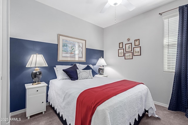 bedroom with baseboards, carpet, and a ceiling fan