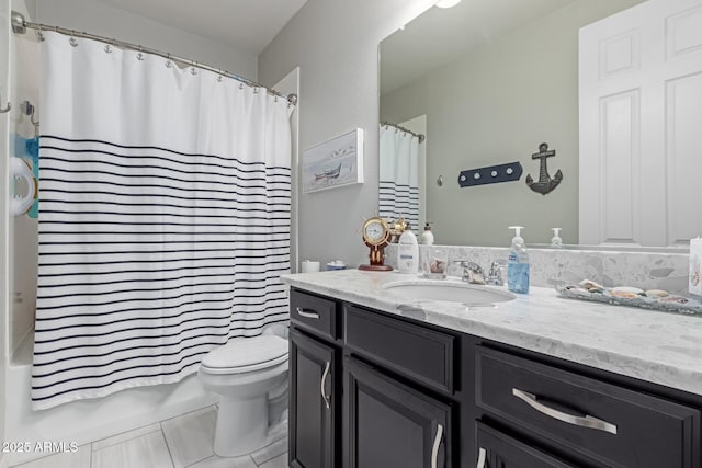 bathroom featuring vanity, shower / bath combination with curtain, and toilet