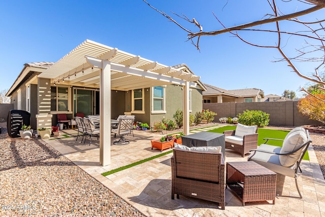 view of patio with an outdoor living space, a fenced backyard, and a pergola