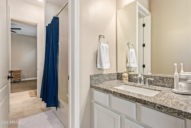 bathroom featuring vanity, tile patterned flooring, ceiling fan, and shower / bath combo