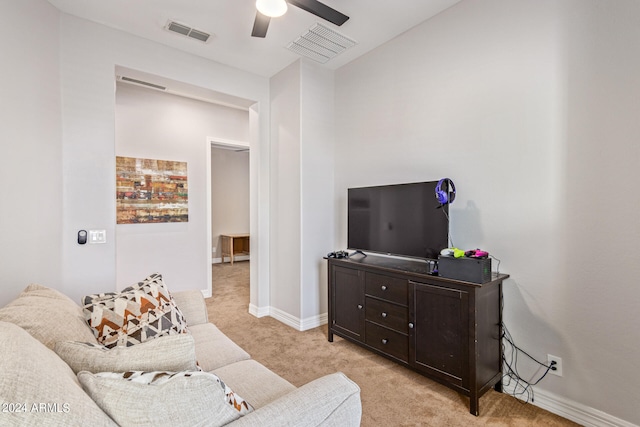 living room featuring ceiling fan and light colored carpet