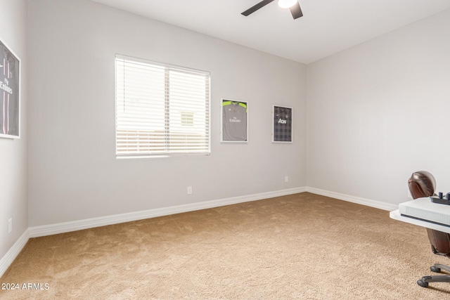 unfurnished office with light colored carpet and ceiling fan