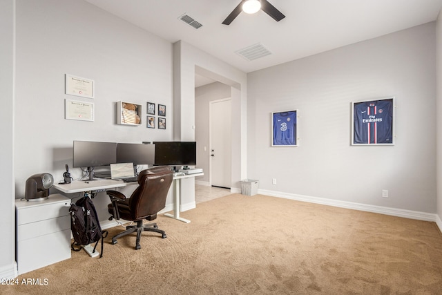 carpeted home office with ceiling fan