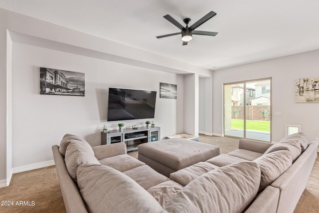 carpeted living room featuring ceiling fan