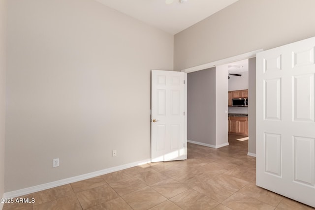 unfurnished room featuring light tile patterned flooring