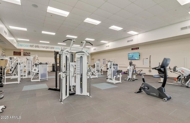 exercise room with a paneled ceiling