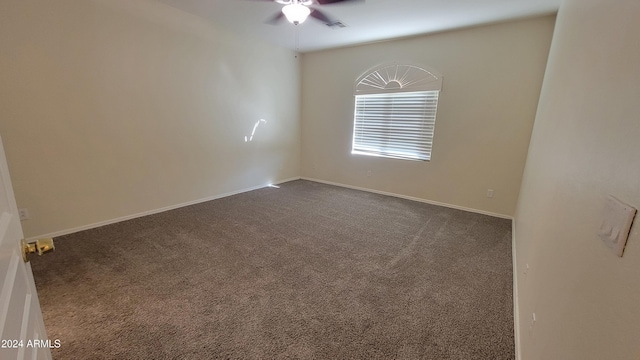 carpeted empty room featuring ceiling fan