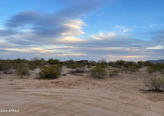 nature at dusk featuring a rural view