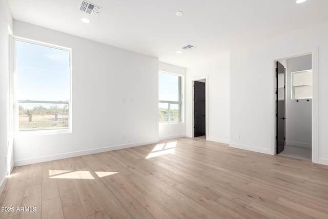 interior space with recessed lighting, baseboards, visible vents, and light wood-type flooring