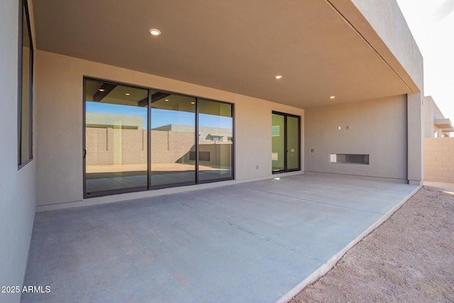 view of patio featuring fence