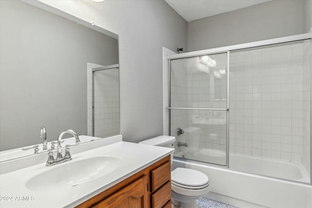 full bathroom with vanity, toilet, and combined bath / shower with glass door