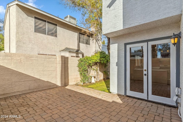 exterior space featuring french doors and central AC