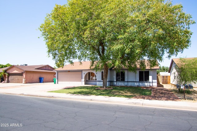 2338 E Javelina Ave, Mesa, AZ 85204 - single story home featuring stucco siding, driveway, and a garage