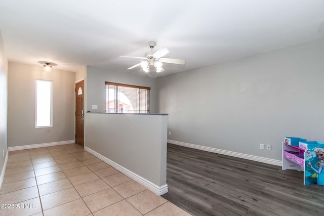 2338 E Javelina Ave, Mesa, AZ 85204 - unfurnished room featuring healthy amount of natural light, a ceiling fan, and wood finished floors