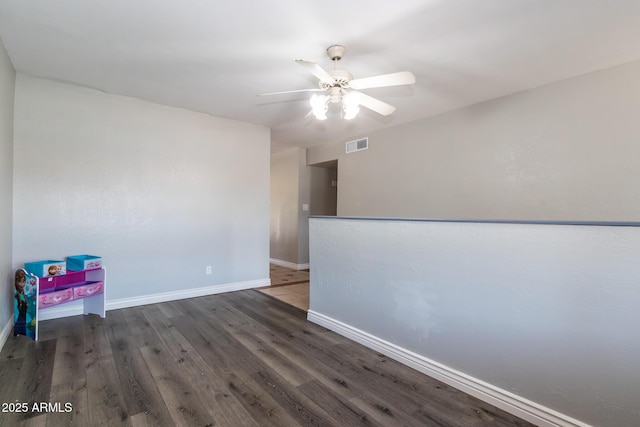 2338 E Javelina Ave, Mesa, AZ 85204 - unfurnished room featuring a ceiling fan and wood finished floors