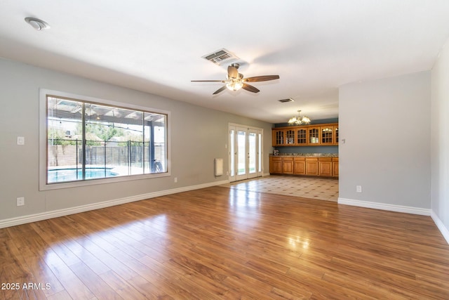 2338 E Javelina Ave, Mesa, AZ 85204 - unfurnished living room with a ceiling fan and light wood finished floors
