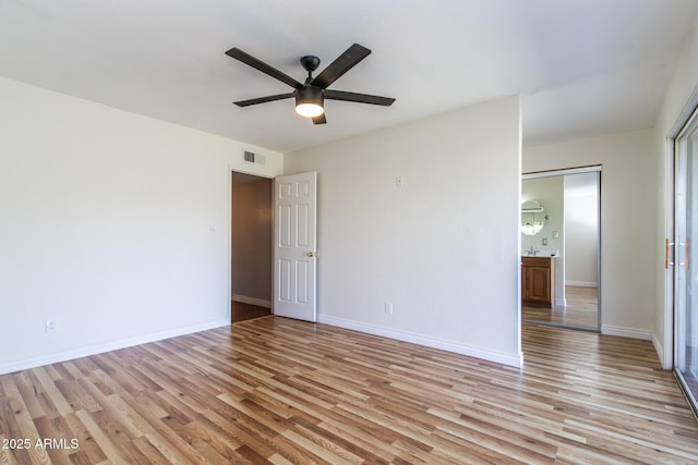 2338 E Javelina Ave, Mesa, AZ 85204 - empty room with light wood-type flooring and ceiling fan