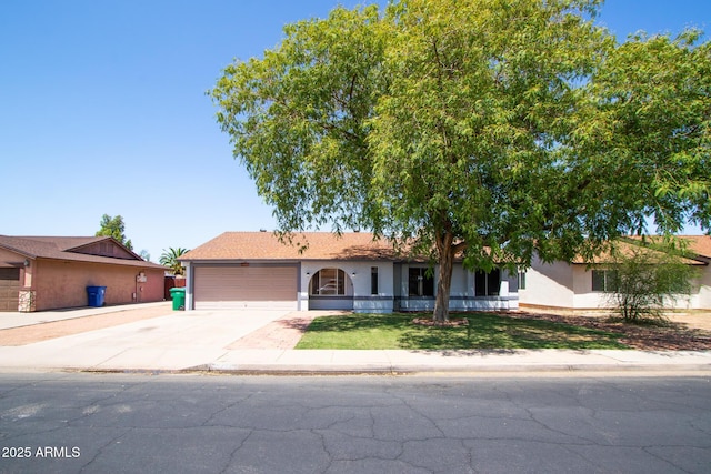 2338 E Javelina Ave, Mesa, AZ 85204 - single story home with driveway, a garage, stucco siding, and a front yard