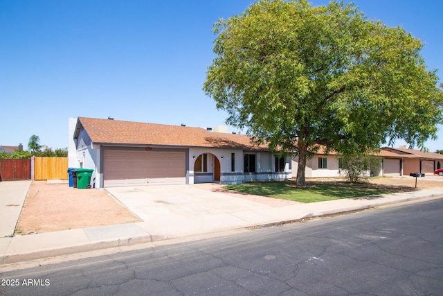 2338 E Javelina Ave, Mesa, AZ 85204 - ranch-style house with a garage, driveway, and stucco siding