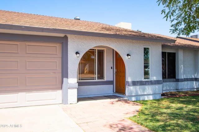 2338 E Javelina Ave, Mesa, AZ 85204 - entrance to property with stucco siding, a garage, and a shingled roof