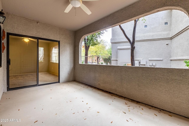 balcony featuring a ceiling fan