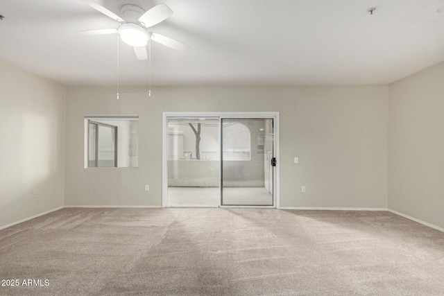 unfurnished bedroom with ceiling fan, baseboards, carpet flooring, and ensuite bathroom