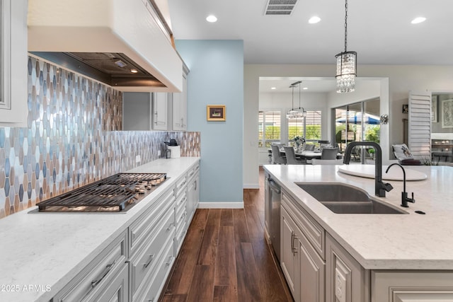 70 E Kennedia Dr, Queen Creek, AZ 85140 - kitchen featuring a sink, custom range hood, dark wood-style flooring, backsplash, and a chandelier