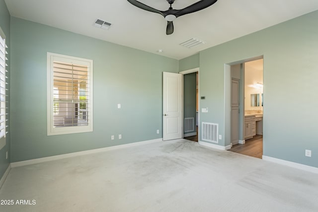 70 E Kennedia Dr, Queen Creek, AZ 85140 - unfurnished bedroom with light carpet, baseboards, and connected bathroom