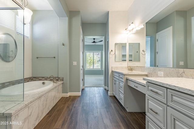 70 E Kennedia Dr, Queen Creek, AZ 85140 - bathroom featuring vanity, a bath, wood finished floors, a ceiling fan, and baseboards