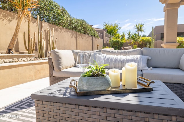 view of patio / terrace featuring an outdoor hangout area and fence