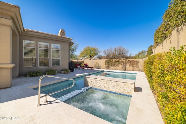 view of pool featuring a fenced in pool, a patio, an in ground hot tub, and a fenced backyard