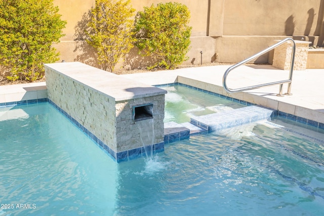 pool featuring an outdoor hot tub