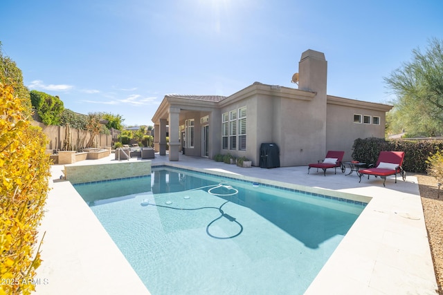 view of pool with a patio, fence, and a fenced in pool