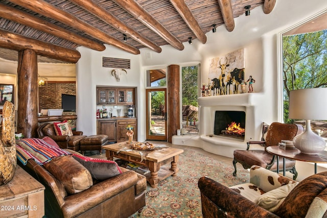 living room featuring beam ceiling and wooden ceiling