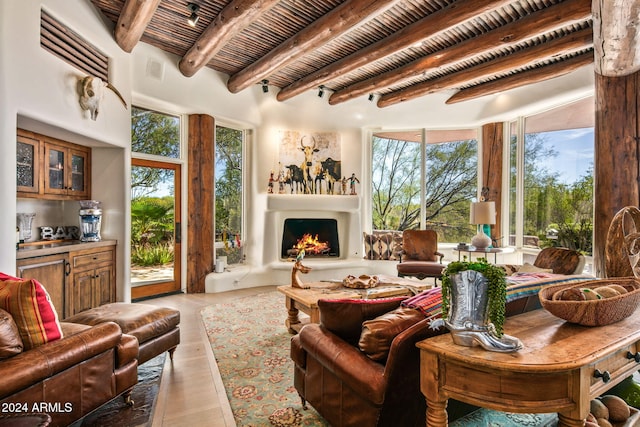 living room with beam ceiling and light wood-type flooring