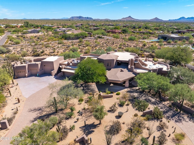 birds eye view of property featuring a mountain view