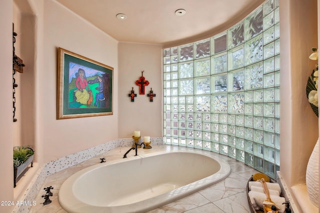 bathroom with tiled bath