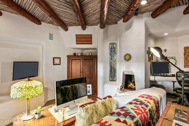 living room with beamed ceiling and wood ceiling