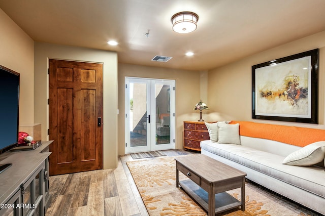 living room featuring hardwood / wood-style floors and french doors