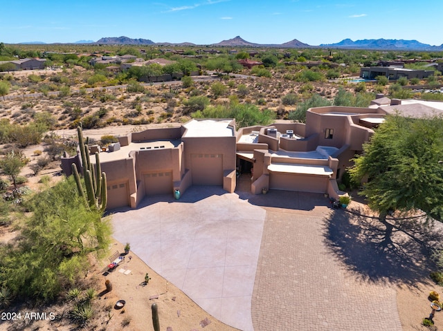 birds eye view of property with a mountain view