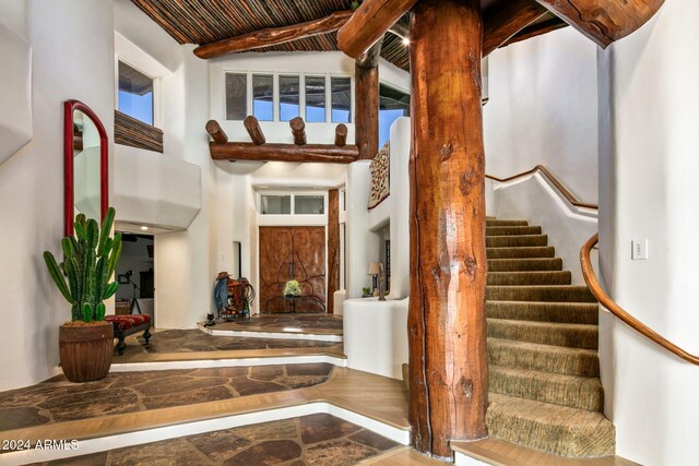 entrance foyer with beamed ceiling and wooden ceiling