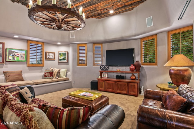 living room featuring light colored carpet and beamed ceiling