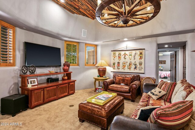 living room with light colored carpet and a towering ceiling