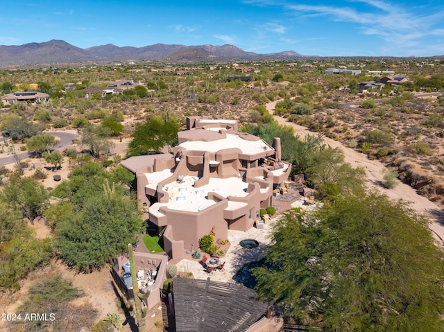 birds eye view of property with a mountain view