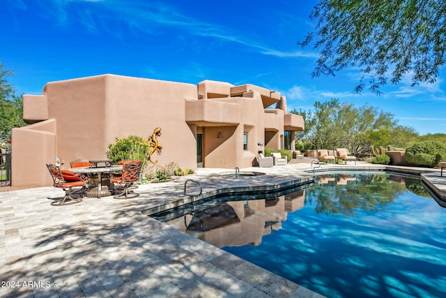 view of swimming pool with a patio area