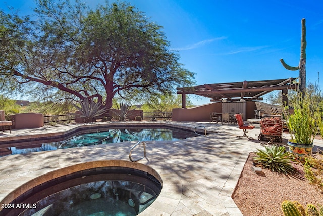 view of pool with a pergola, a patio area, and an outdoor hot tub