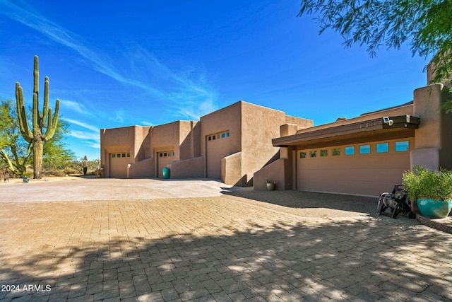 southwest-style home with a garage