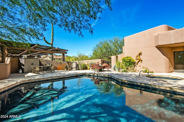 view of swimming pool with a patio and a pergola