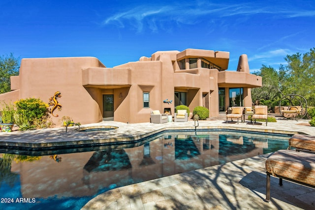 view of pool with a patio area and a jacuzzi